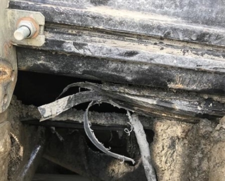 Another image of a skirt damage and spillage issues with previous system